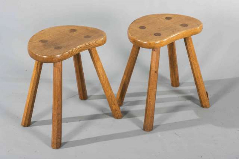 DEREK SLATER, A PAIR OF LIZARDMAN OAK STOOLS, with kidney shaped tops and splayed faceted legs, with carved lizard signatures.