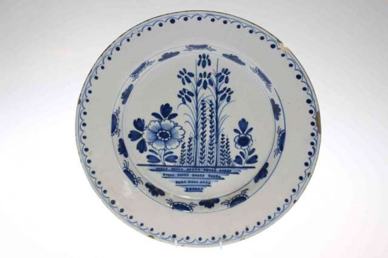 18th Century Delft blue and white charger with foliate decoration