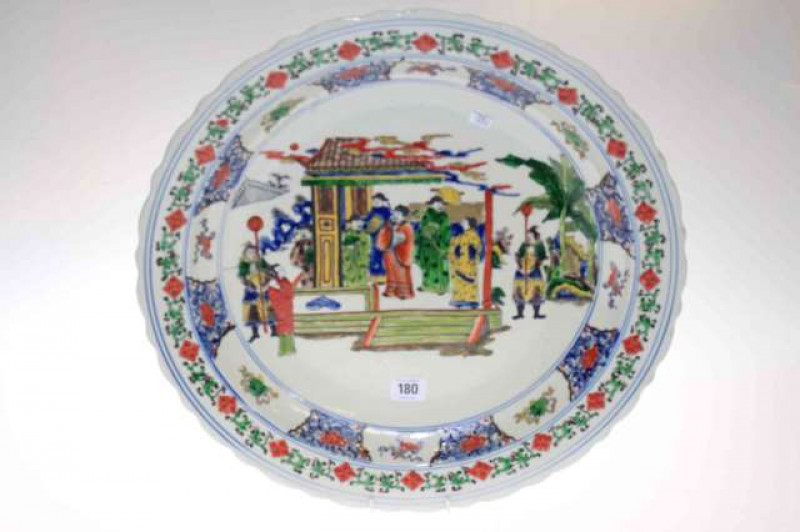 Oriental pottery charger with figure and floral design, 45cm diameter
