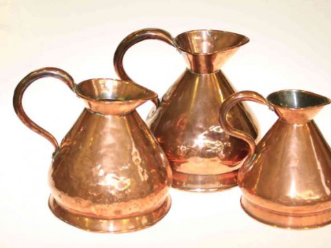 Graduated set of 19th Century copper measuring jugs