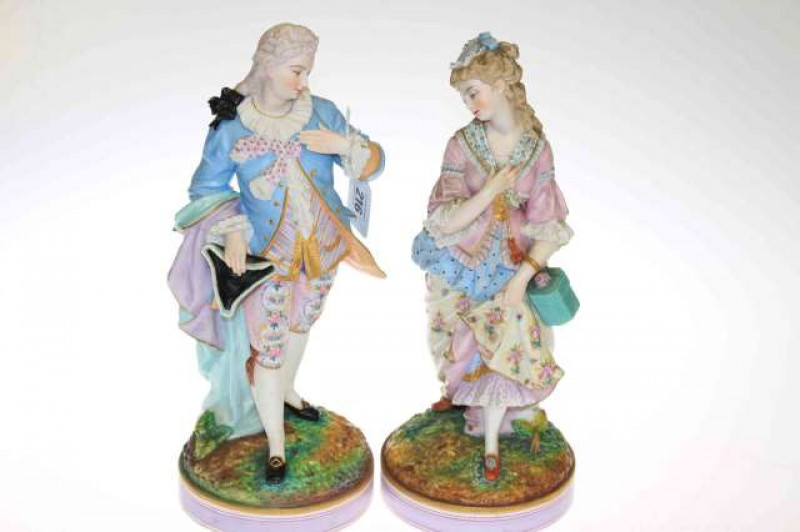 Pair of 19th Century tinted bisque figures of a lady and gentleman in 18th Century dress