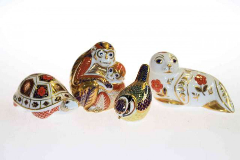 Collection of four Royal Crown Derby paperweights, tortoise, seal, monkey and bird