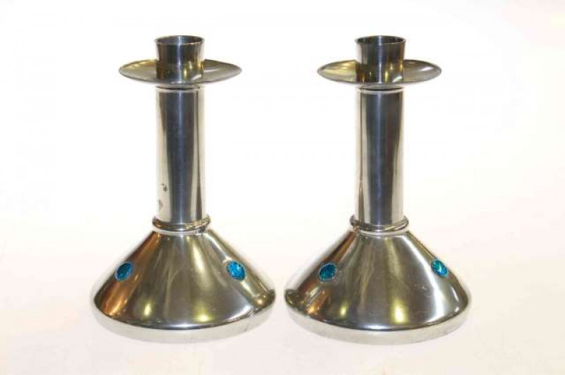 Archibald Knox for Liberty & Co, a pair pewter and enamel candlesticks