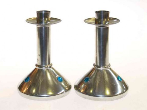 Archibald Knox for Liberty & Co, a pair pewter and enamel candlesticks