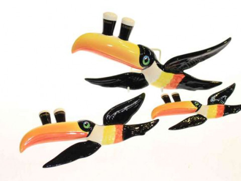 Three Carlton Ware Guinness flying toucan wall plaques