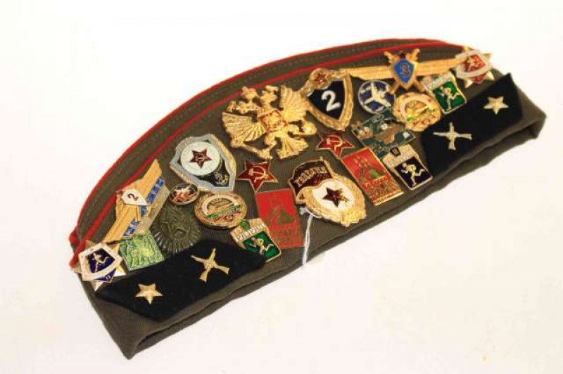 Russian veterans cap and twenty six military badges