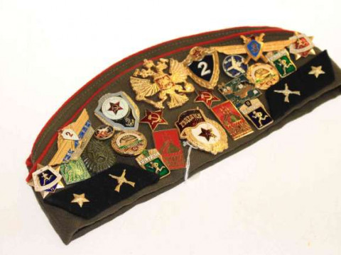 Russian veterans cap and twenty six military badges