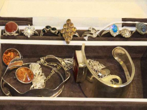 Jewellery box containing eight silver rings and a quantity of silver jewellery...