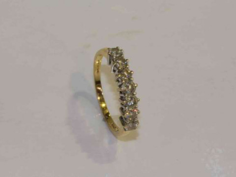 18 carat gold and seven stone diamond ring