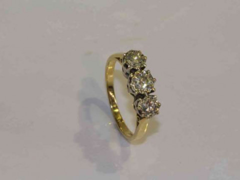 18 carat gold and three stone diamond ring