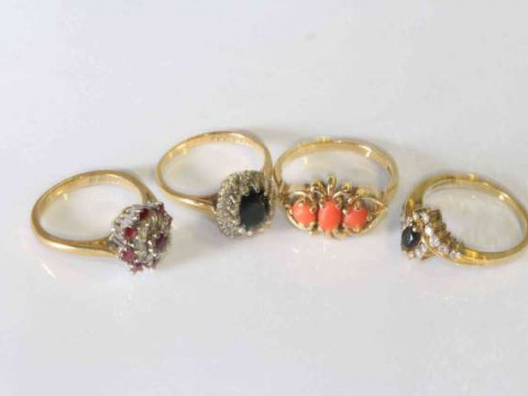 Four 9 carat gold gem set rings, gross 13 grams