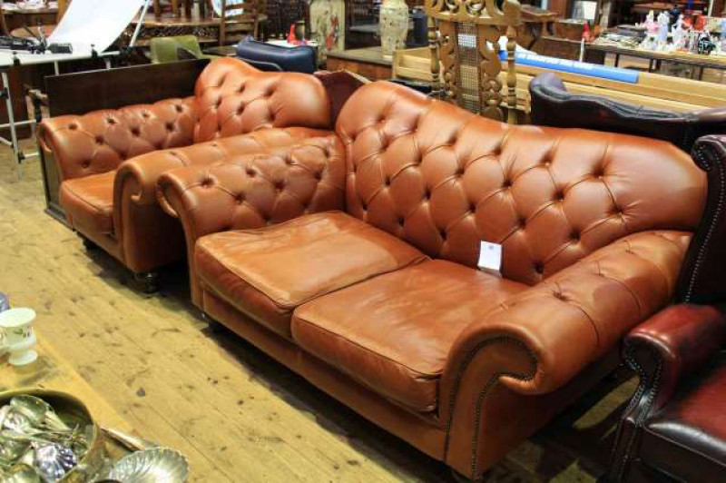 Tan leather deep buttoned two seater settee and chair
