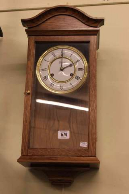 Oak cased Comitti wall clock