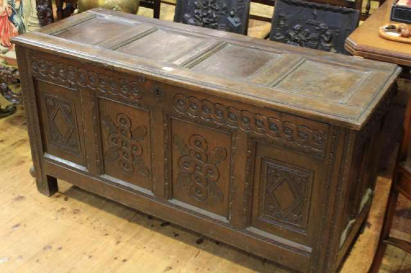 Antique oak carved four panel front coffer