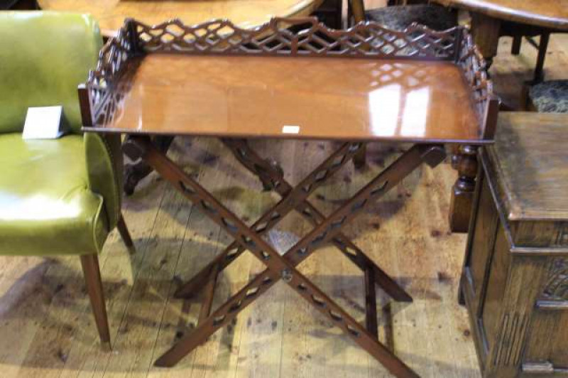 Mahogany butlers tray and stand, with three-quarter pierced gallery