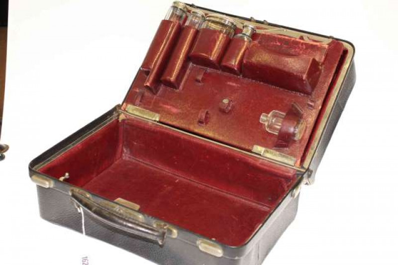 Gentleman's toilet bag containing some bottles