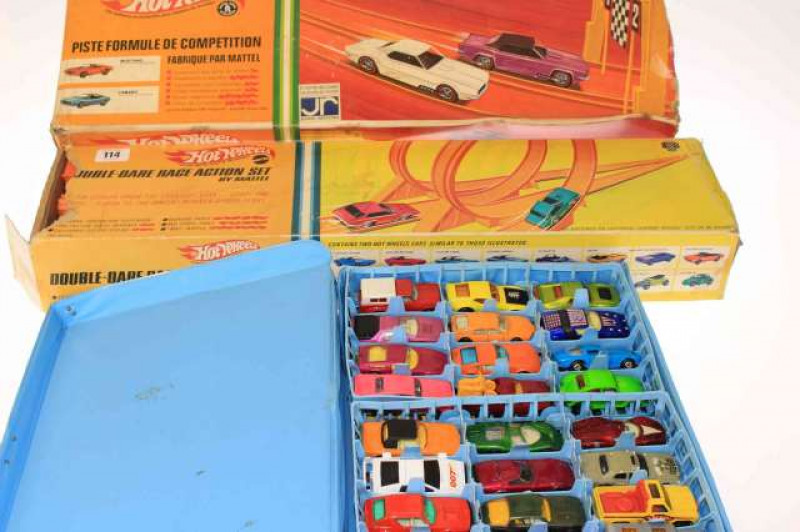 Two Hot Wheels racing sets and Matchbox Superfast case with cars