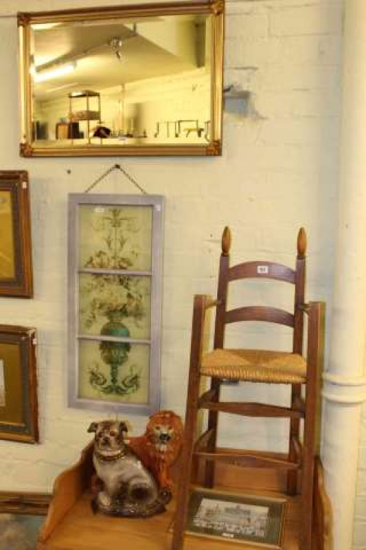 Pottery lion and pug, child's chair, gilt framed mirror and two pictures