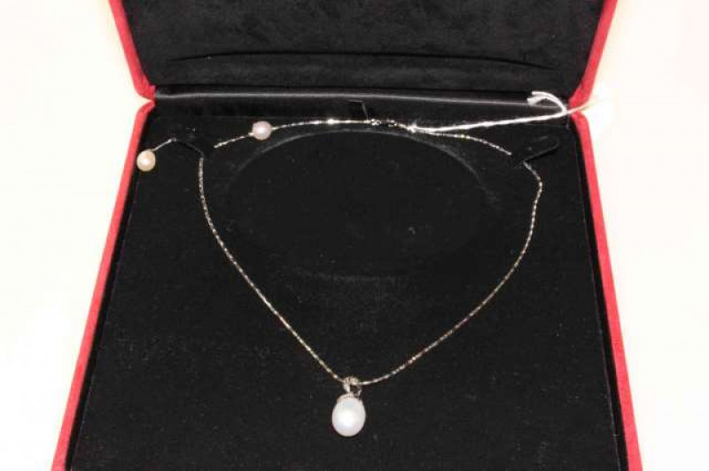 A suite of Italian cultured pearl jewellery, comprising a pair of drop earrings and a pendant necklace, stamped 585
