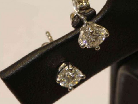 Pair of brilliant cut diamond stud earrings, 18 carat gold, total diamond...