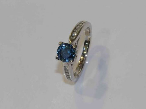 Platinum, round sapphire and diamond ring, sapphire approximately 1.20...