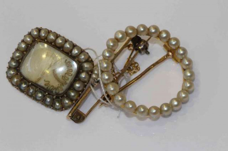 Three antique brooches, each set with pearls (unwarranted and untested)