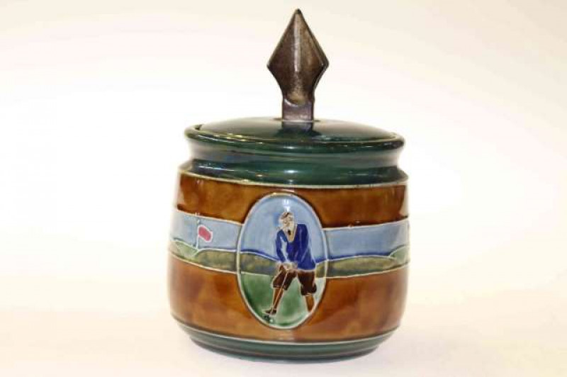 Golfing interest: a Clifton stoneware tobacco jar