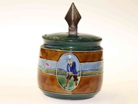 Golfing interest: a Clifton stoneware tobacco jar