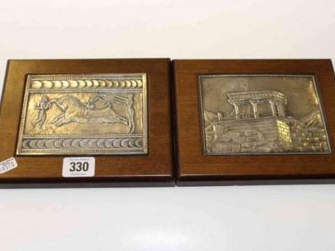Pair of Astron white metal plaques