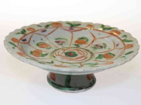Unusual footed dish with scalloped edge