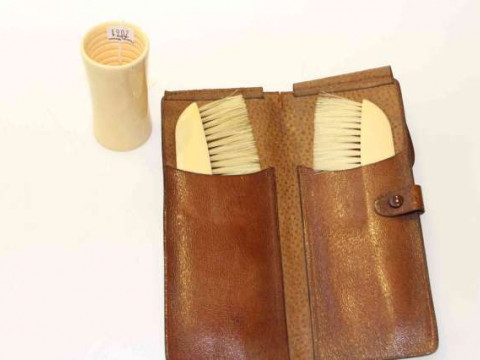 Pair of ivory mounted brushes, cased, early 20th Century; and a late 19th...