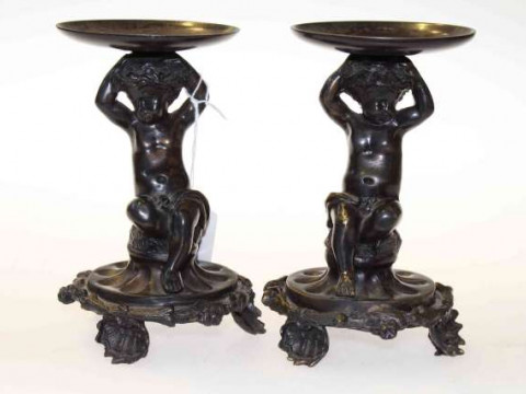 Pair of bronze figural putti stands