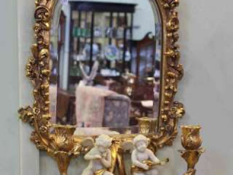 Gilded and moulded girandole mirror