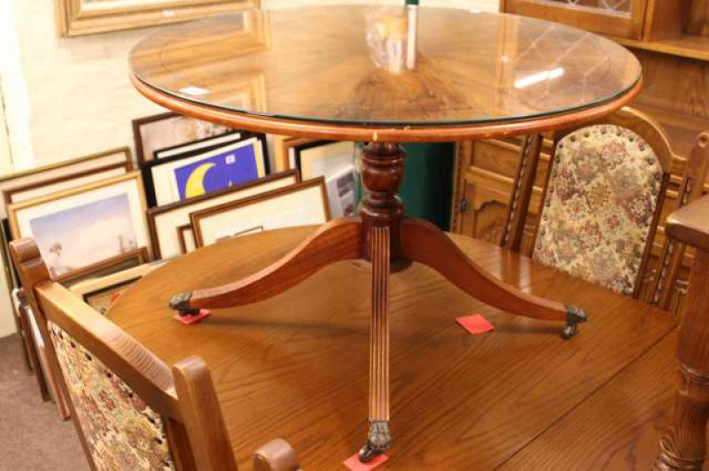 Yew wood finish circular pedestal coffee table