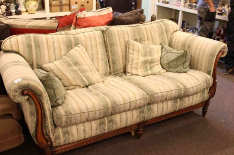 Mahogany framed scroll arm settee in green striped floral fabric