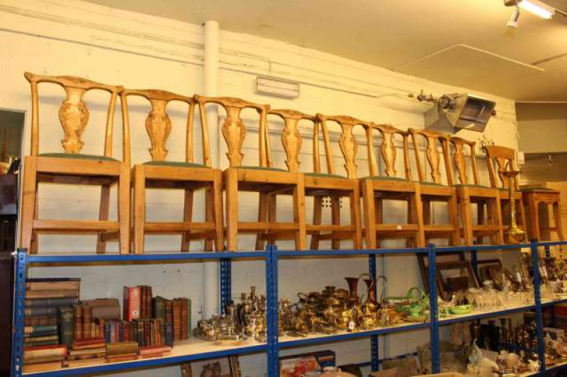 Set of eight lightwood dining chairs with green leather seats and similar chair