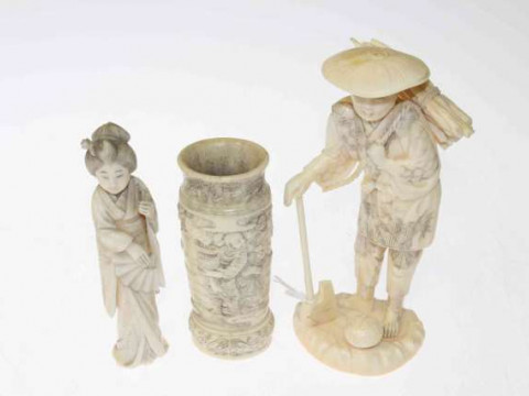 Japanese Meiji period okimono, carved as a wood cutter; bone spill vase...