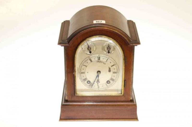 Mahogany arch topped mantel clock with silvered dial