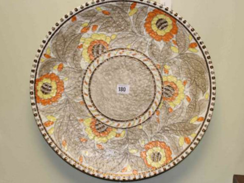 Large Charlotte Rhead plaque with floral design, 44cm diameter