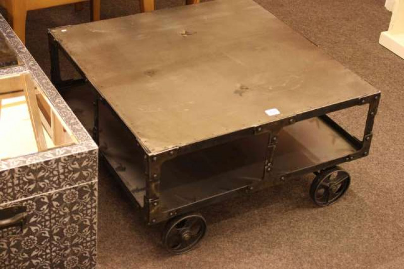 Contemporary metal coffee table in the form of a bogie