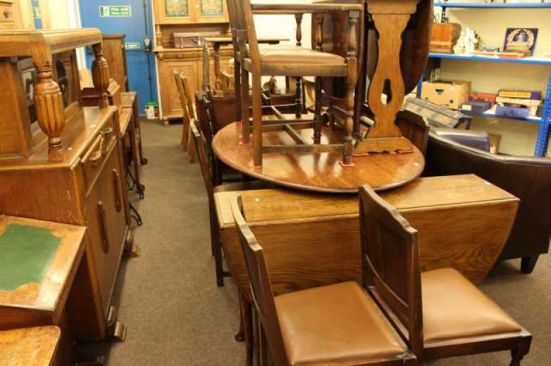 Carved oak buffet sideboard, three oak dining tables and six dining chairs (10)