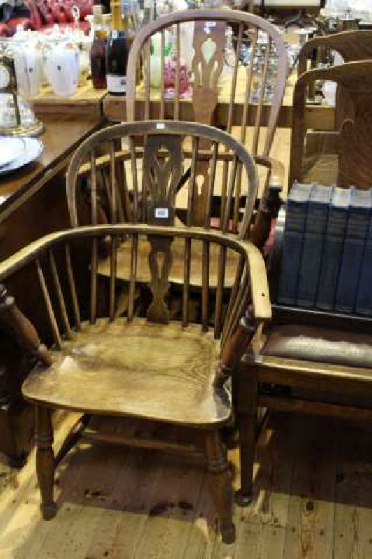 Two 19th Century elm Windsor pierced splat back elbow chairs