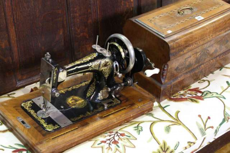 Vintage hand sewing machine in inlaid case