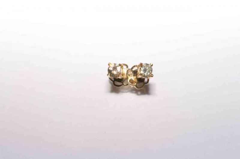 Pair of 18 carat gold round brilliant cut diamond stud earrings, total diamond weight approximately 0.31 carats