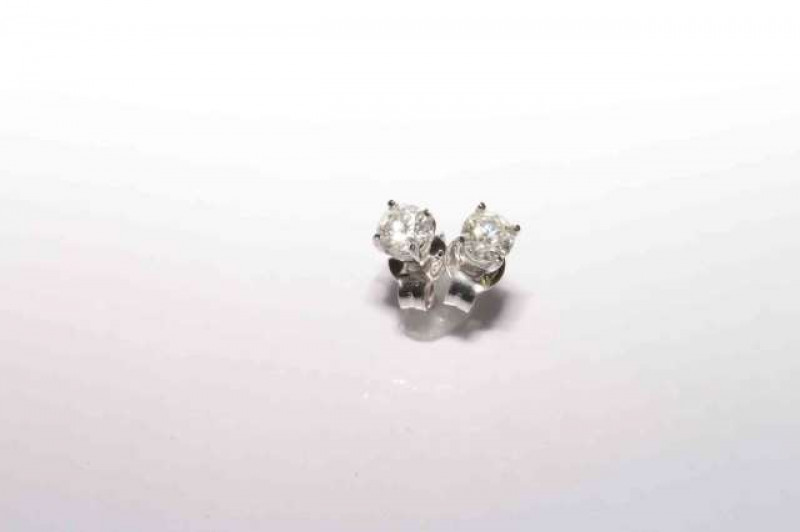 Pair of 18 carat gold round brilliant cut diamond stud earrings, total diamond weight approximately 0.64 carats