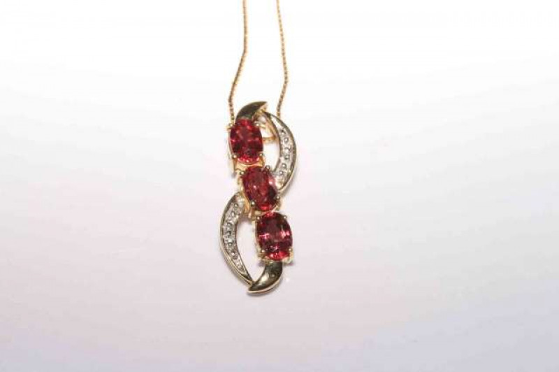 9 carat gold, beryllium and diamond pendant on 9 carat gold chain