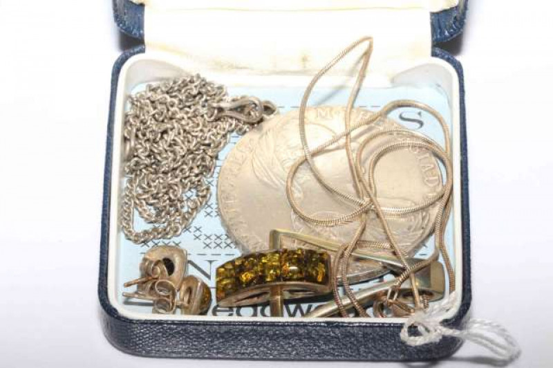 Silver coin pendant and a suite of green amber coloured jewellery