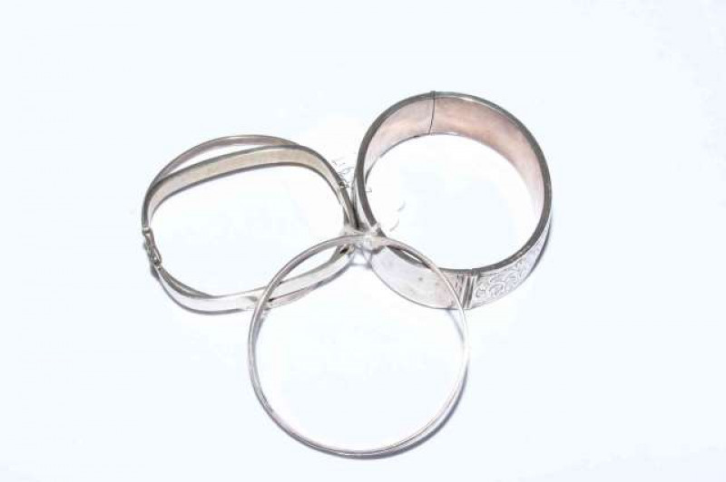 Four silver bangles