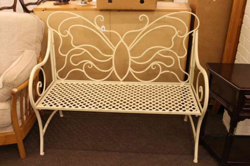 Wrought iron garden bench in cream painted finish with butterfly design back