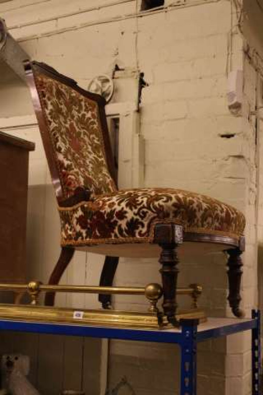 Mahogany framed Victorian nursing chair and brass fender